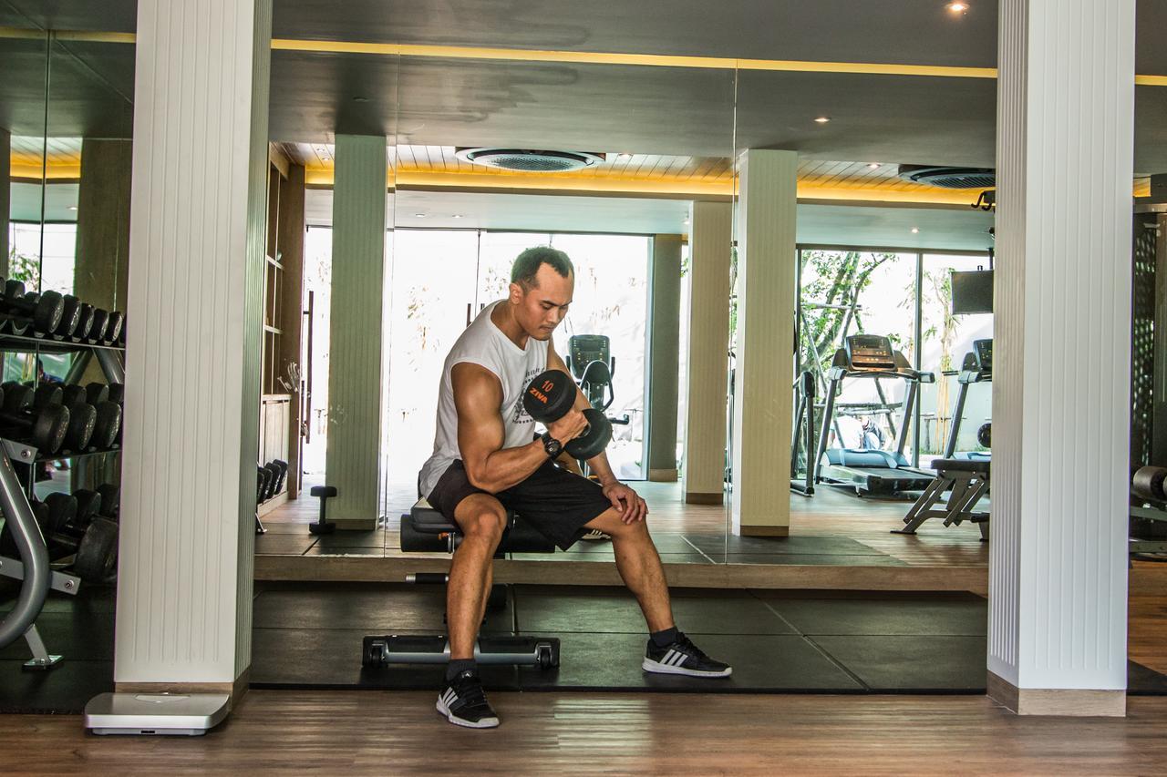 Fusion Suites Phuket Patong Екстериор снимка A man lifting weights
